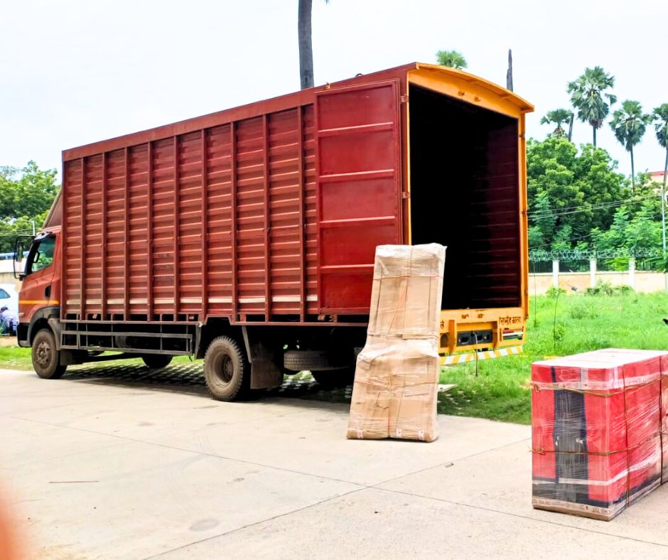 truck of om packers nad movers parking in road for next relocation