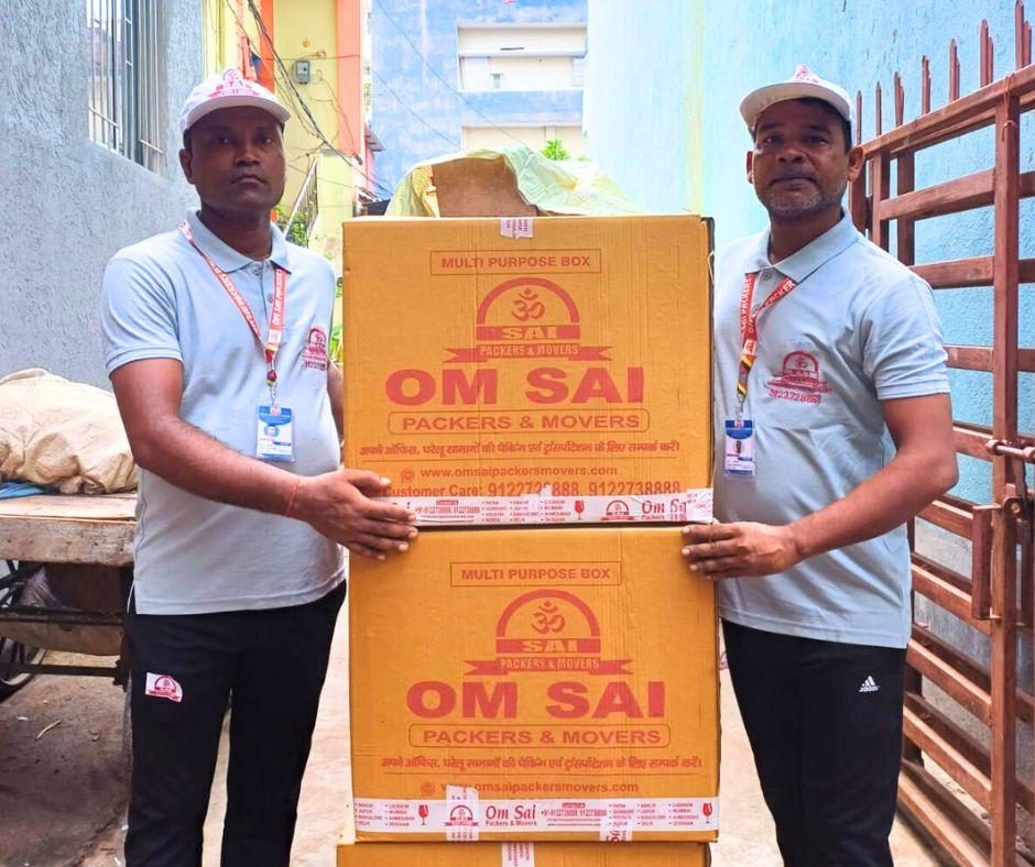 Om Sai Packers and Movers staff handling secure packing with branded boxes – professional packers and movers in Raipur